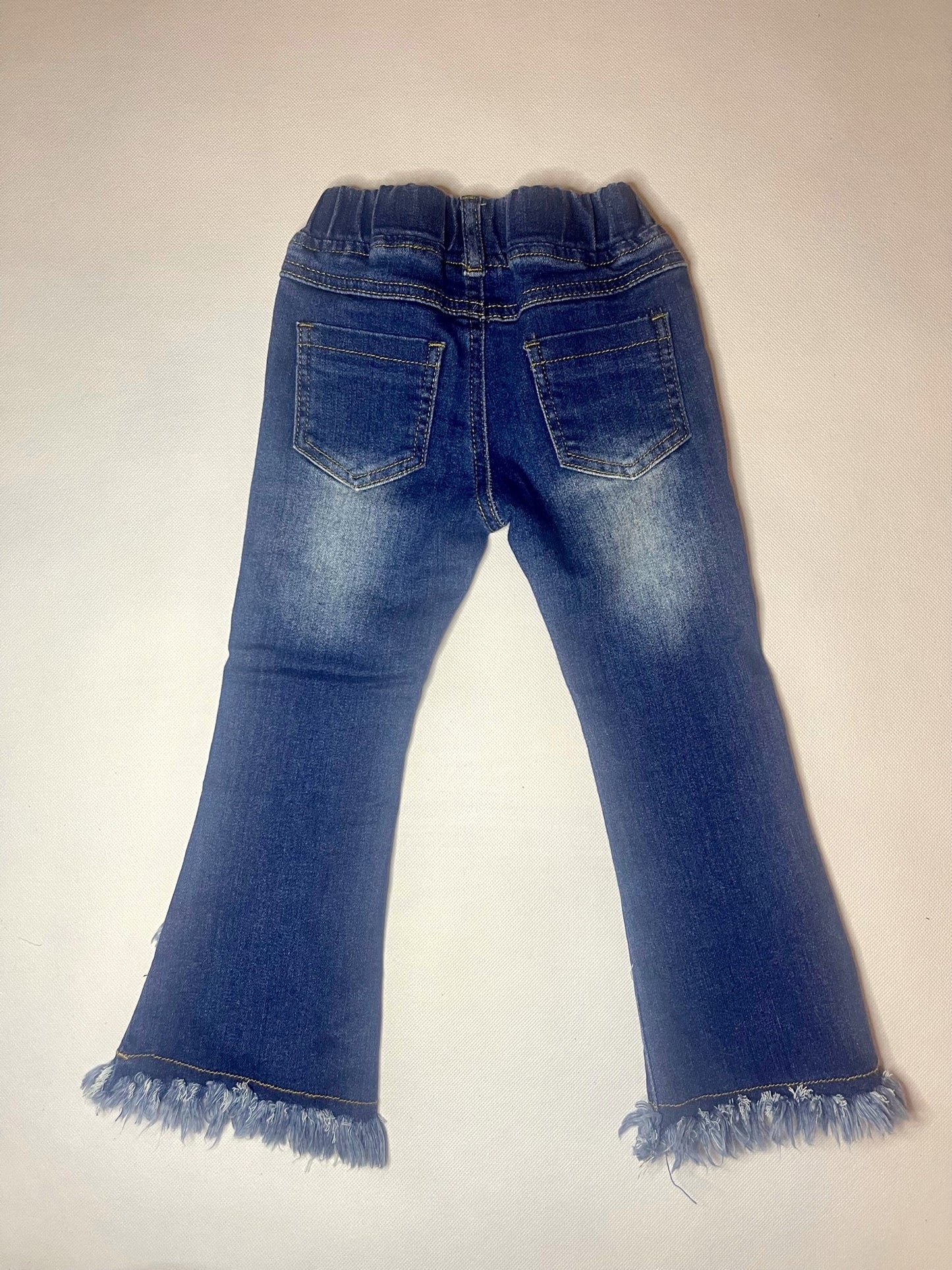 Medium Wash Shaggy Criss Cross Bottom Jeans